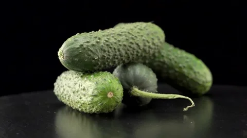 Fresh cucumbers close up on black background Video stock 140614611