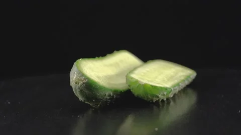 Fresh cucumbers close up on black background Stock Footage 140788542