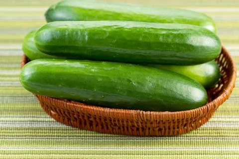 Fresh cucumbers inside of basket Stock Photos