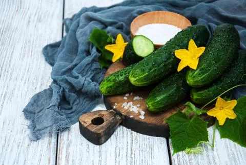 Fresh cucumbers on a table Stock Photos