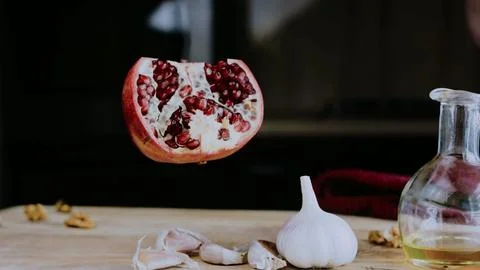 Fresh culinary presentation: mixing spices into creamy walnut sauce 스톡 사진