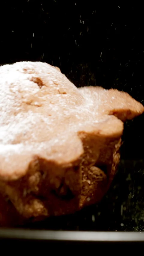 Fresh cupcake falls on a black plate Stock Footage 344860111