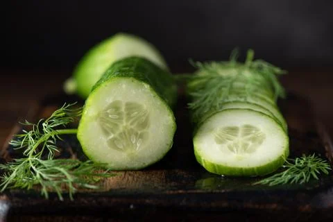 Fresh cut cucumber with dill Stock Photos