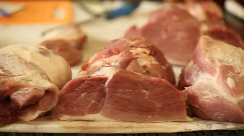 Fresh cut meat lying on the counter for sale Stock Footage 44300610