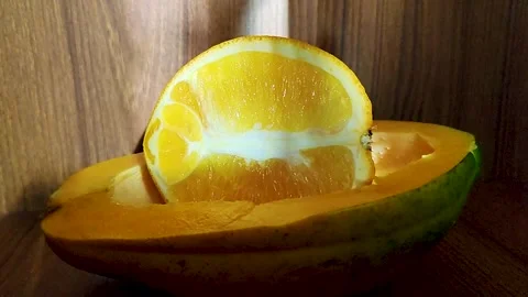 Fresh Cut Papaya Slice in Natural Light Stock Footage 319441237