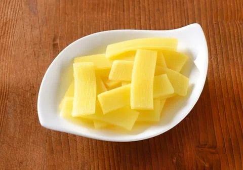 Fresh cut pineapple chunks in a bowl Stock Photos