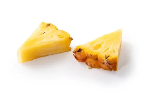 Fresh cut pineapple fruit isolated on white background with clipping path. Stock Photos