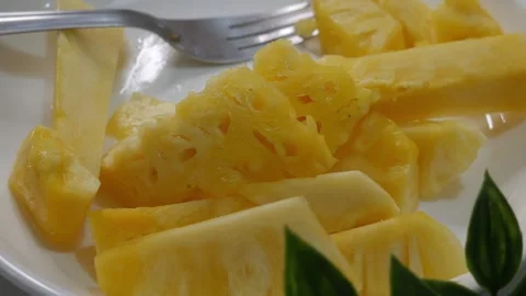 Fresh Cut Pineapple Slices on White Plate Stock Footage 327949522