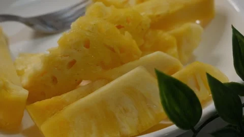 Fresh Cut Pineapple Slices on White Plate Stock Footage 327949547
