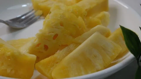Fresh Cut Pineapple Slices on White Plate Видео 330566396