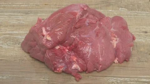 Fresh Cuts of Premium Quality Raw Meat Elegantly Displayed on a Rustic Wooden Stockbeeldmateriaal 284133609