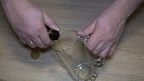 Fresh dark craft unfiltered unpasteurized beer in a glass mug Stock Footage 123739043