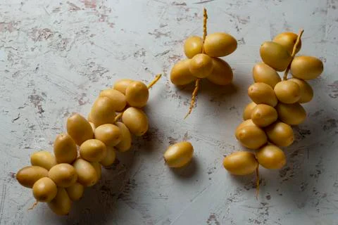 Fresh dates fruit on texture white background Stock Photos