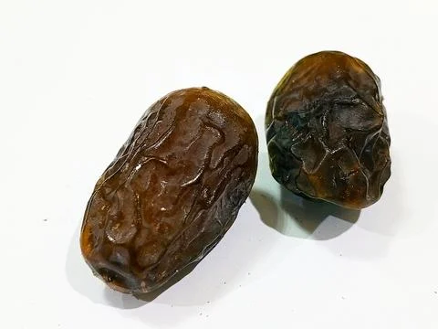 Fresh dates on a white background Stock Photos