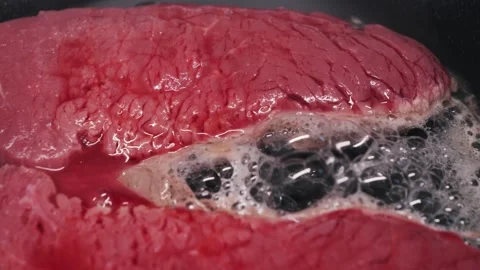 Fresh delicious beef chop frying in a frying pan. Concept of healthy diets. Stock Footage 314333499