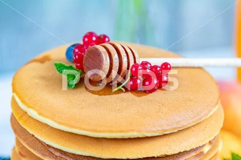 Fresh delicious pancakes with summer berries on light surface Stock Photos