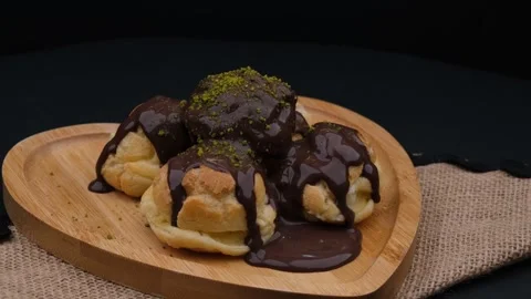 Fresh delicious profiterole 스톡 동영상 260163304