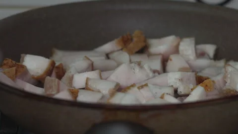 Fresh Diced Bacon Lardons Cooking in a Hot Nonstick Frying Pan Video stock 339630466