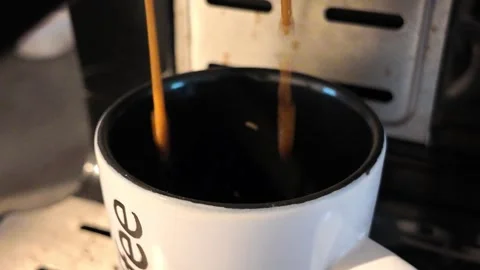 Fresh double espresso pouring from coffee machine Stock Footage 345080832