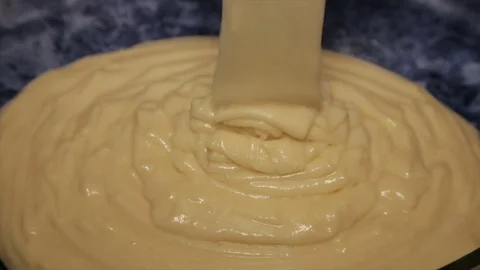 Fresh dough in the form of a pastry. Close-up . Vidéo 75687902