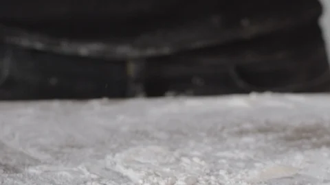 Fresh dough in slow motion. Sprinkling flour over fresh dough for pizza or bread Stock Footage 124877681