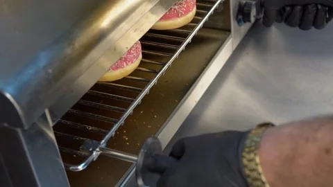 Fresh doughnuts on a baking sheet Stockbeeldmateriaal 84817305