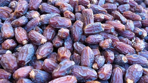 Fresh dried dates fruit texture background during slow panning motion in ou.. Stock Footage 332211618