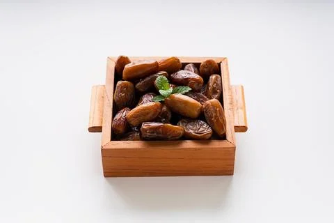 Fresh dried dates fruit on white isolated background. Stock Photos