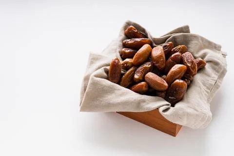 Fresh dried dates fruit on white isolated background. Stock Photos