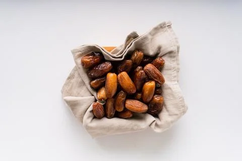 Fresh dried dates fruit on white isolated background. Foto stock