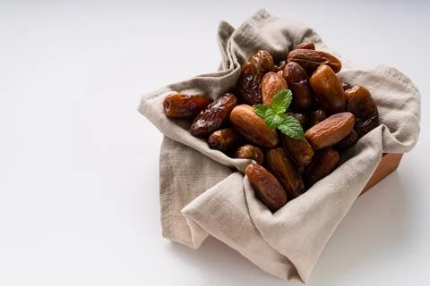 Fresh dried dates fruit on white isolated background. Stock Photos