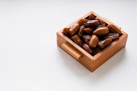Fresh dried dates fruit on white isolated background. Foto stock