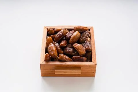 Fresh dried dates fruit on white isolated background. Stock Photos