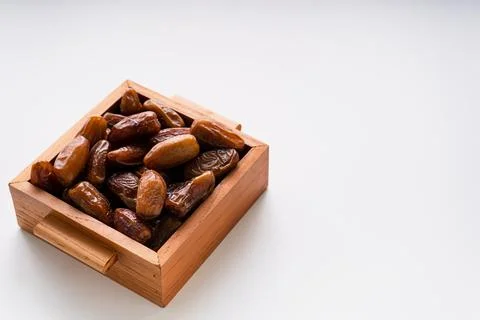 Fresh dried dates fruit on white isolated background. Stock Photos