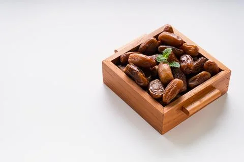Fresh dried dates fruit on white isolated background. Stock Photos