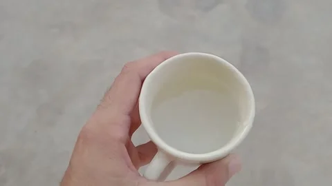 Fresh Drinking Water in a Cup During a Peaceful Morning Stock Footage 346568601