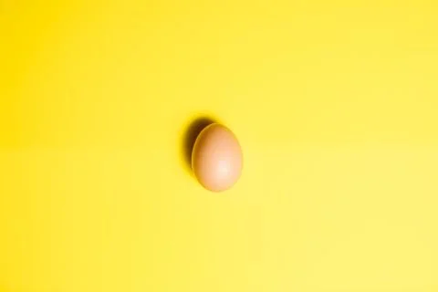 Fresh Easter Egg on a Yellow Background. Happy Easter Stock Photos