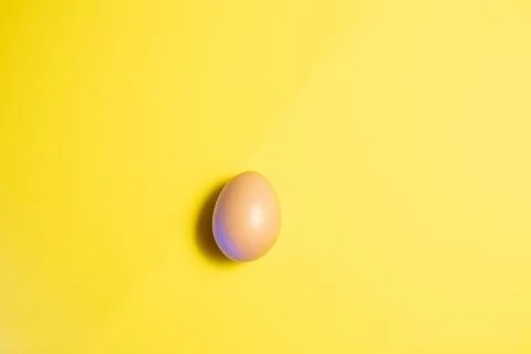 Fresh Easter Egg on a Yellow Background. Happy Easter Stock Photos