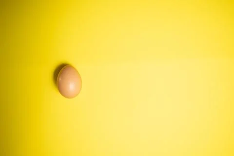 Fresh Easter Egg on a Yellow Background. Happy Easter Stock Photos