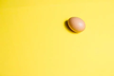 Fresh Easter Egg on a Yellow Background. Happy Easter Stock Photos