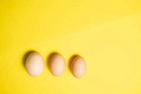 Fresh Easter Eggs on a Yellow Background. Happy Easter Stock Photos