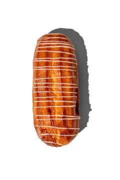 Fresh eclair isolated on a white background, hard shadows by the sun top view 库存照片