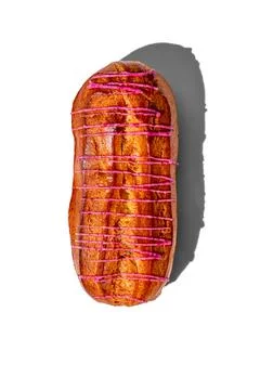 Fresh eclair with red glaze isolated on a white background, hard shadows by t Stock-Fotos