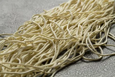 Fresh Egg Noodles with Raw Egg and Flour on Wooden Board Stock Photos