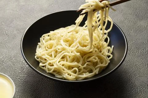 Fresh Egg Noodles with Raw Egg and Flour on Wooden Board Фото