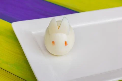 Fresh egg shaped like an easter bunny on a white late Stock Photos