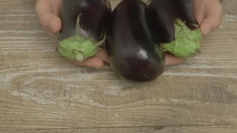 Fresh Eggplants Beautifully Displayed on a Rustic Wooden Table Ready to Be 스톡 동영상 283126072