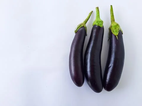 Fresh Eggplants on White Background Fotos de archivo