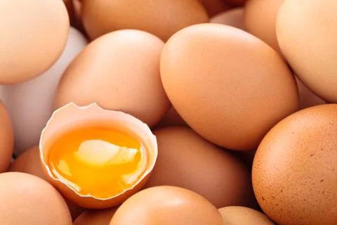 Fresh eggs background. Stock Photos