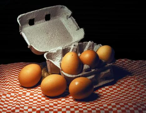 Fresh eggs on box Photos